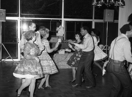 Guests dancing at the National Association of Media Women's western hoedown, Los Angeles, 1983