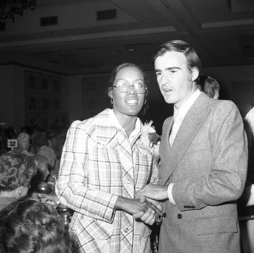 Jerry Brown posing with a woman at a special event, Los Angeles, 1973