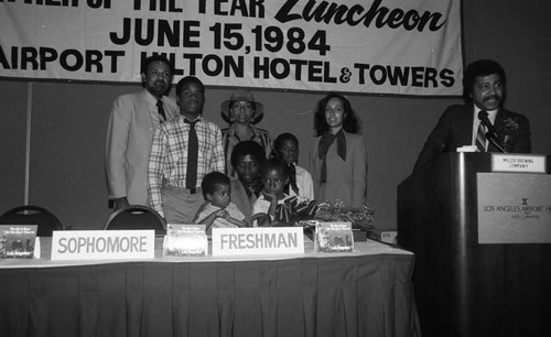 Father of the Year Frank Freeman posing with his family and others, Los Angeles, 1984