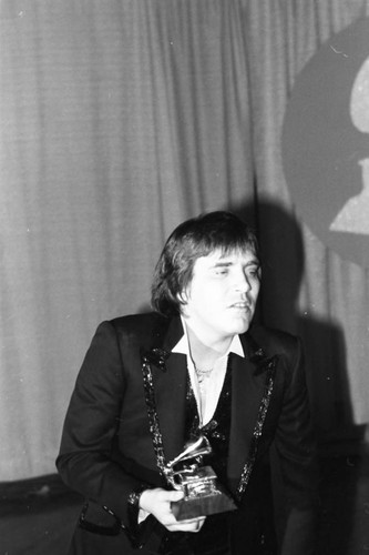 José Feliciano posing with his Grammy at the 26th Annual Grammy Awards, Los Angeles, 1984