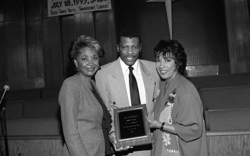 Ali Woodson posing with his award at a "Youth on Parade" event, Los Angeles, 1993