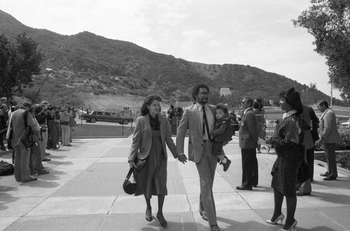 Couple with a child arriving at Marvin Gaye's funeral service, Los Angeles, 1984