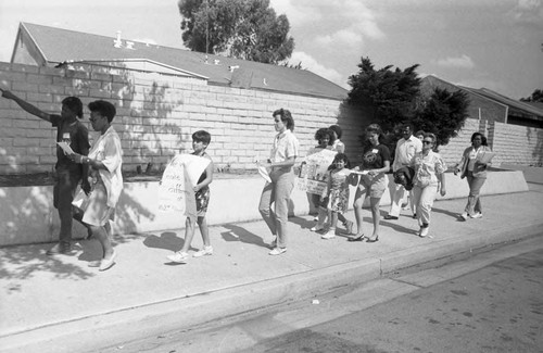 Children and adults protesting on behalf of 102nd Street Elementary School, Los Angeles, 1987