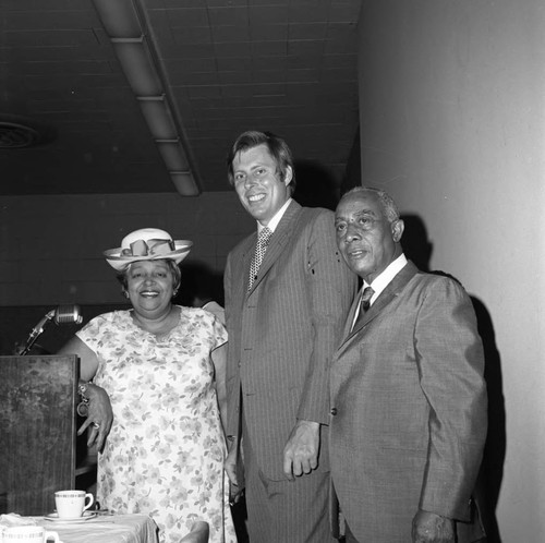 Gilbert and Teresa Lindsay posing with John Tunney at the opening of the new Kearny Post Office, Los Angeles, 1972