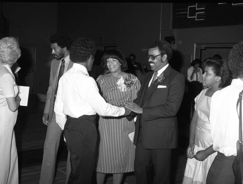 Dr. Rex Fortune greeting attendees at a special event, Inglewood, California, 1983