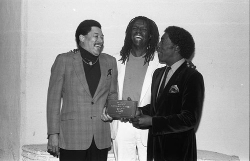 Edward C. Lawson and Renaldo Rey holding an award at the Pied Piper nightclub, Los Angeles, 1986