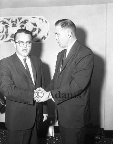 Shaking hands, Los Angeles, 1964