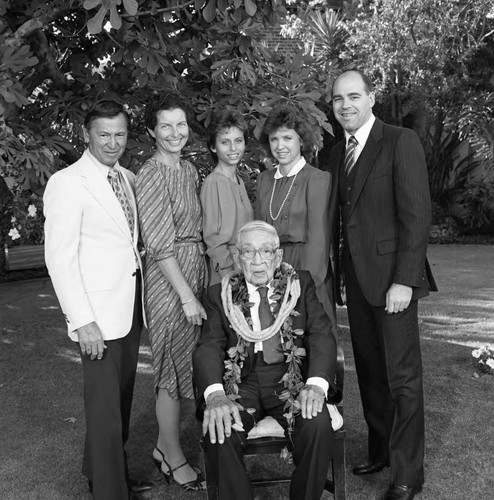 Dr. H. Claude Hudson posing with family during his 100th birthday celebration, Los Angeles, 1986