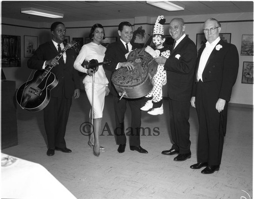 Entertainers posing together during a Family Savings and Loan celebration, Los Angeles, 1964