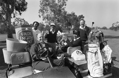 Jim Lawrence and Joe Solomon posing with others on a golf course, Los Angeles, California, 1983