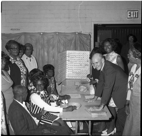 Senator Alan Cranston and Mayor Doris Davis visiting a Compton senior center, Compton, California, ca. 1974