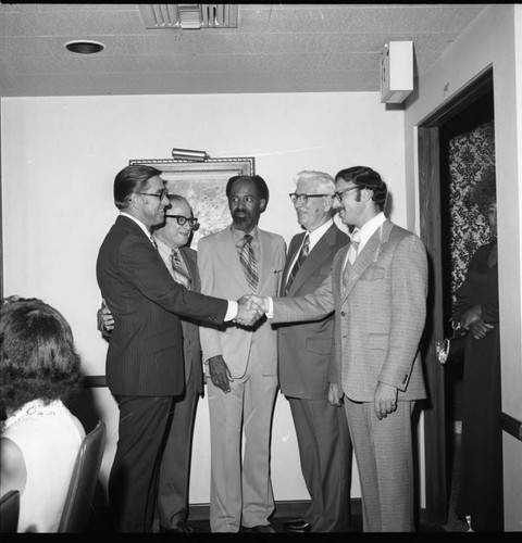 Men in business suits talking, Los Angeles