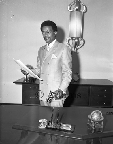 Johnny Cochran standing, Los Angeles, 1969 — Calisphere