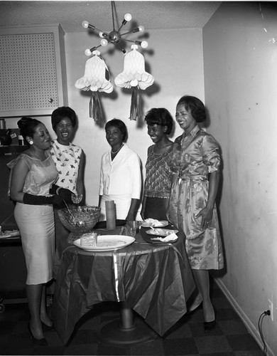 Burnistine and La Doris McClaney celebrating at a wedding shower, Los Angeles, 1960