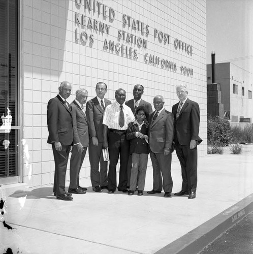 Gilbert Lindsay, Kenneth Hahn, and Dr. H. Claude Hudson posing outside of the new Kearny Post Office, Los Angeles, 1972