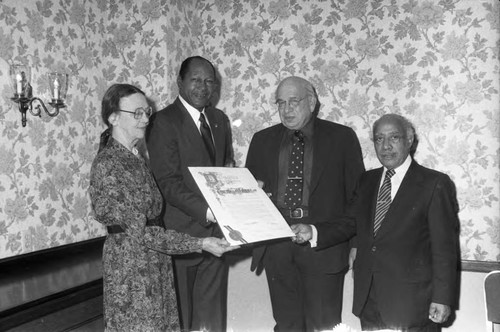 Mayor Tom Bradley, Gil Lindsay and others posing with a commendation, Los Angeles, 1983