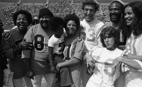 Participants in the Celebrity All-Star touchdown contest posing together, Los Angeles, 1973