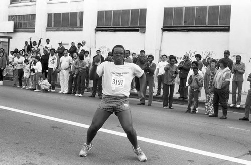 Runner dancing for the camera during the first LA Marathon, Los Angeles, 1986