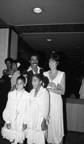 Richard Pryor posing with Jennifer Lee and his daughters, Los Angeles, 1978