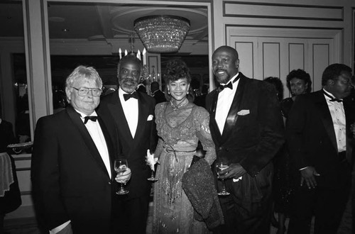 Lou Gossett, Jr., Cindi Gossett, and Al Nellum posing together at the Black Emmy nominees dinner, Los Angeles, 1989