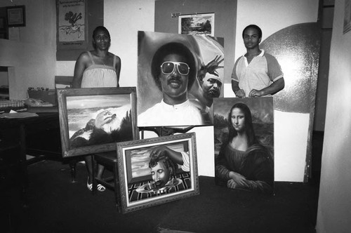 Al Hornsby posing with his paintings, Los Angeles, 1984