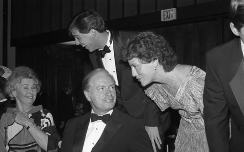 Philip M. Hawley speaking with a woman during the Urban League's Whitney M. Young, Jr. Awards Dinner, Los Angeles, 1988