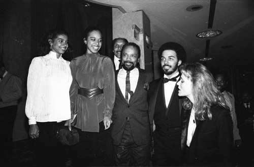 Quincy Jones talking with Peggy Lipton, James Ingram and others at a Neighbors of Watts benefit, Los Angeles, 1982