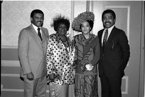 Two African American couples posing for a group portrait, Los Angeles, 1987