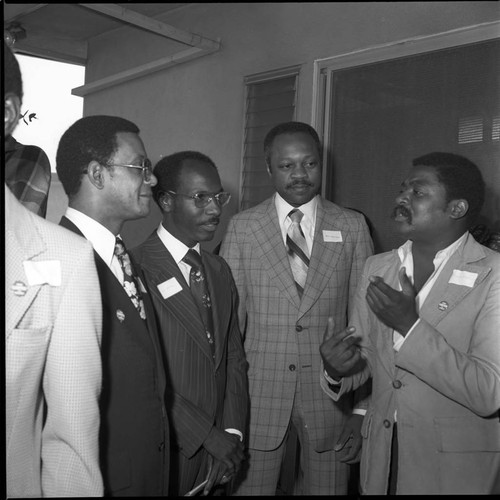 Carter For President meeting attendees in discussion, Los Angeles, 1976