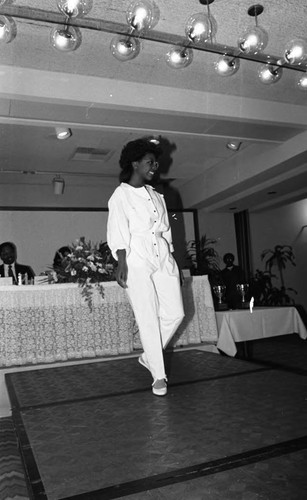 Model walking the runway during a graduation and fashion show, Los Angeles, 1986