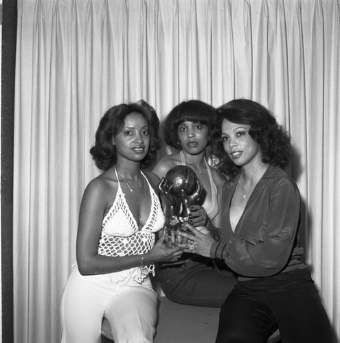 Women posing with an NAACP Image Award, Los Angeles, 1978