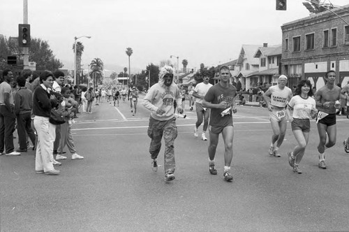 Runner wearing a werewolf mask during the first LA Marathon, Los Angeles, 1986