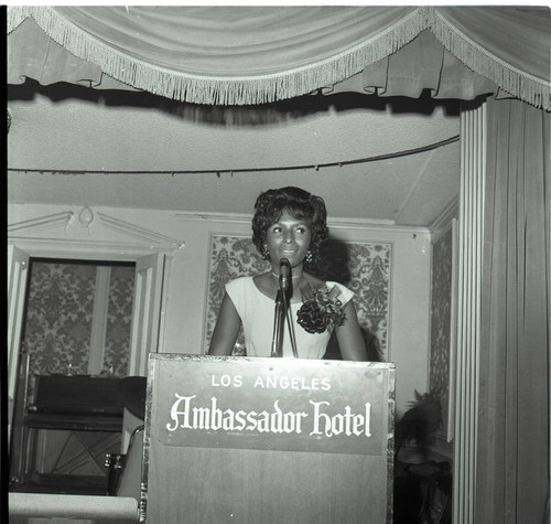 Doris Davis speaking from a lectern at the Ambassador Hotel, Los Angeles, 1973