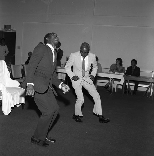 Bishop Barnes church service participants responding to his sermon, Los Angeles, 1976