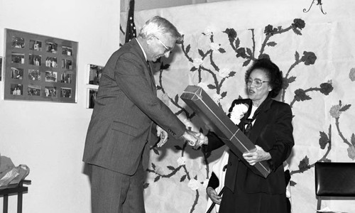 Rita Walters receiving a gift at the Estelle Van Meter Multipurpose Center, Los Angeles, 1989