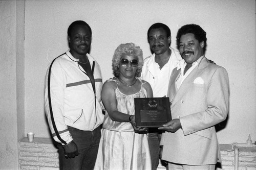 Reynaldo Rey posing with others at the Piper nightclub, Los Angeles, 1984