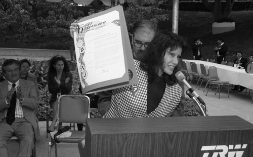 Woman holding a proclamation of the City of Hawthorne, Hawthorne, California, 1994