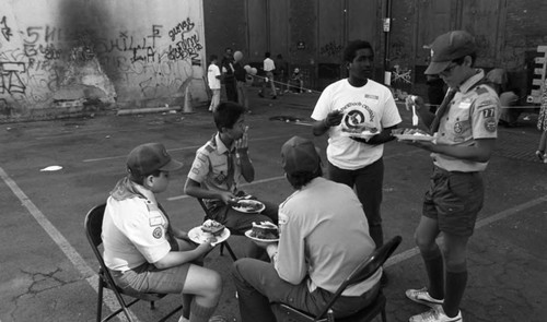 Friends feeding friends, Los Angeles, 1986