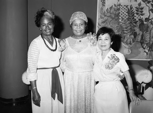 Zephra Dunn posing with others during a reception celebrating her retirement, Los Angeles, 1983