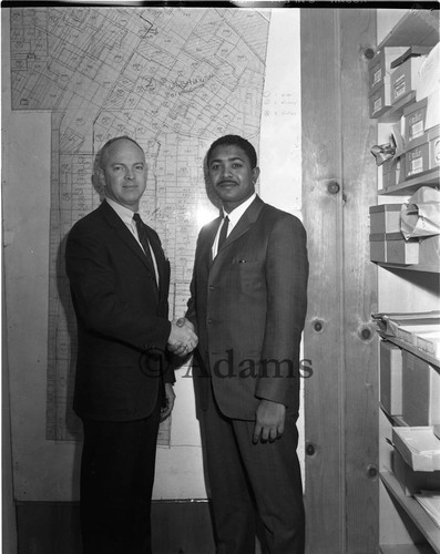 Dymally shakes hands, Los Angeles, 1963