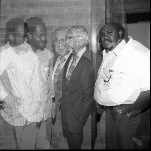 Dr. H. Claude Hudson talking with others, Los Angeles, 1972