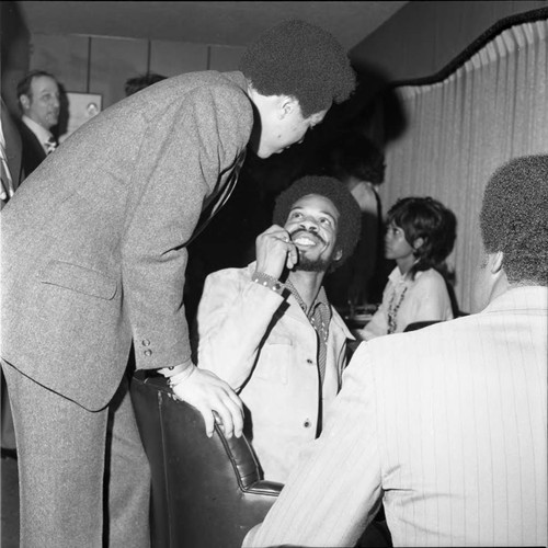 Smokey Robinson and Roland Bynum at a party, Los Angeles, 1971