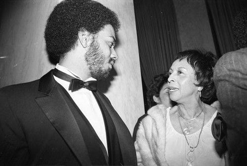 James Ingram talking with Gertrude Gipson at a Neighbors of Watts benefit, Los Angeles, 1982