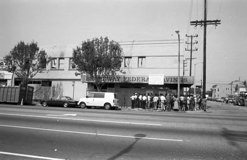 Crowd gathering at the destroyed Broadway Federal Savings and Loan building, Los Angeles, 1992