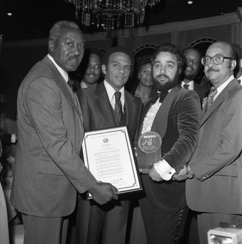 Andrew Young posing with Nate Holden, Danny Bakewell, and Lonnie Bunkley, Los Angeles, 1978