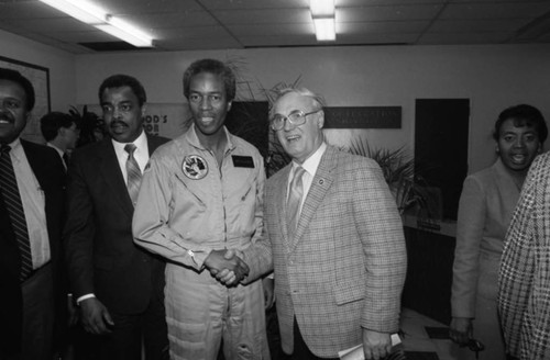 Astronaut Guy Bluford shaking hands during a school visit, Los Angeles, 1985