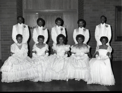 Epsilon Eta Omega Chapter, AKA debutantes posing with their escorts, Los Angeles, 1984