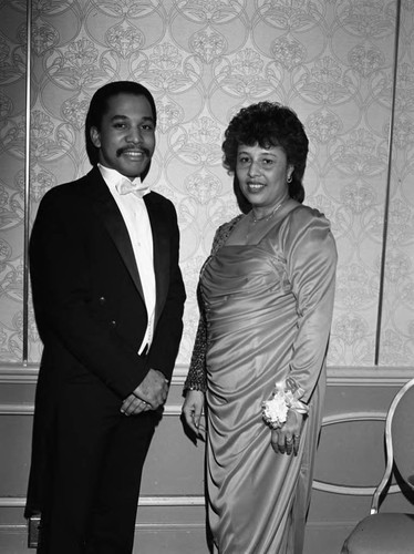 Ardell Jackson posing with Gentry Akins II during the Phi Delta Kappa Bal' Des Amants, Los Angeles, 1987