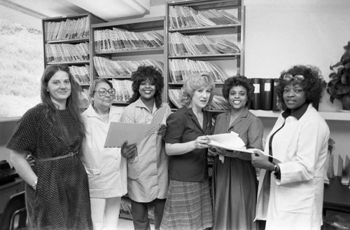 Crenshaw medical office staff posing for a group portrait, Los Angeles, 1983