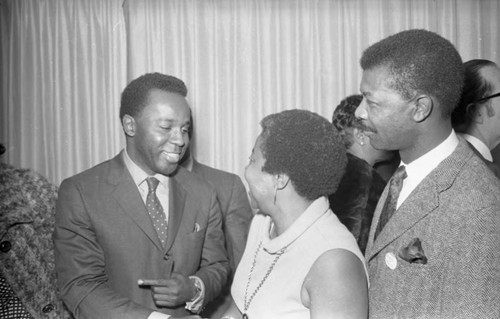 Supporters greeting each other during Tom Bradley's mayoral campaign, Los Angeles, 1969